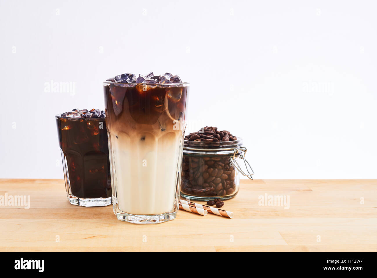 Iced coffee in jar, mug glass cup on the white table Stock Photo - Alamy