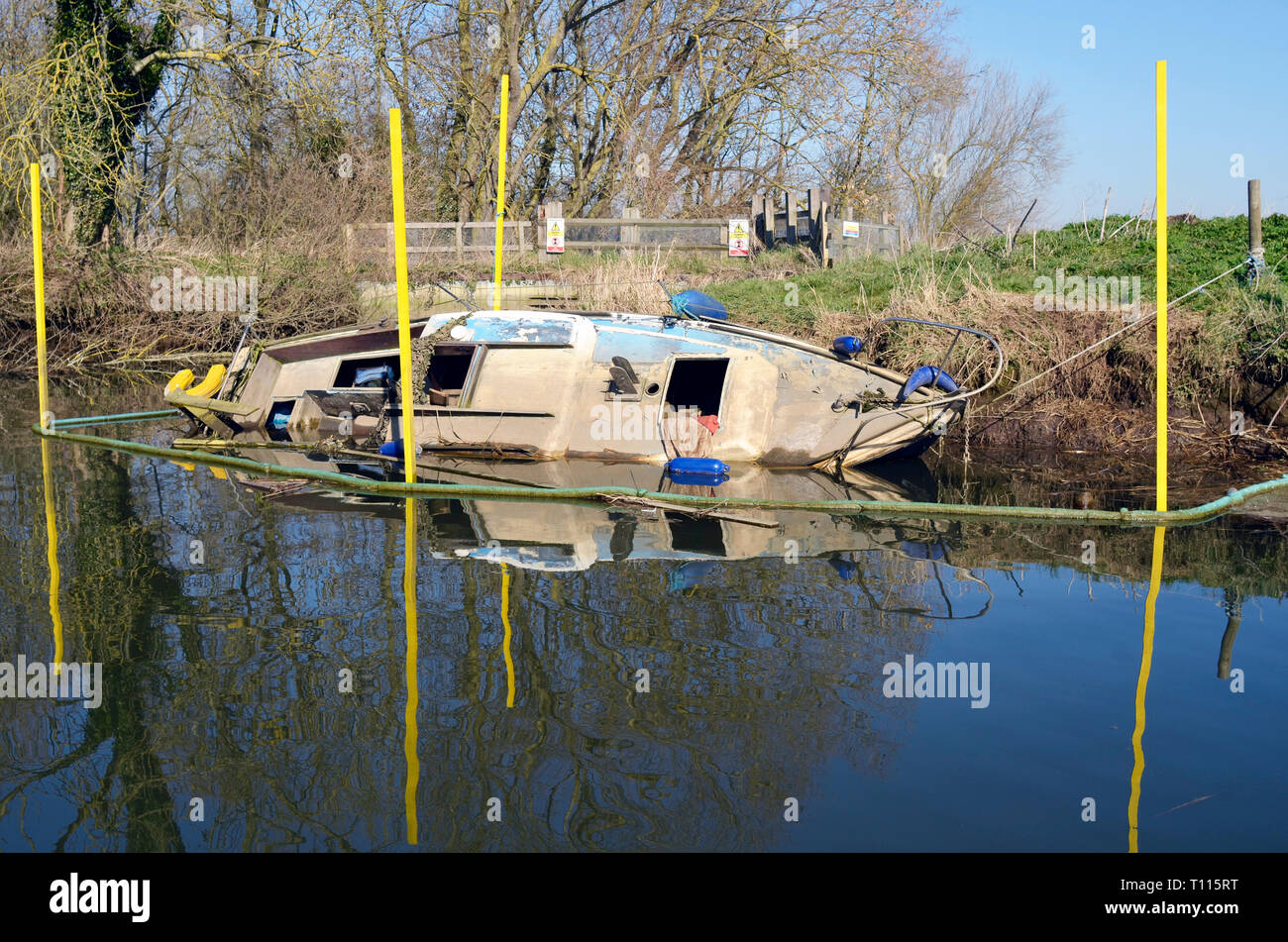 abandoned sunken boat  on river waveney geldeston norfolk england Stock Photo
