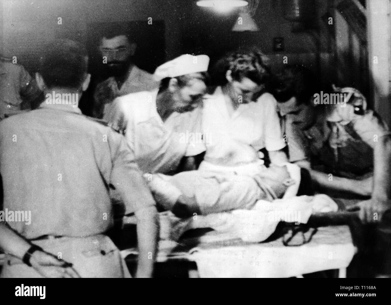 Indochina War 1946 - 1954, battle at di bi Phu, 13.3. - 7.5.1954, arrival a wounded Foreign Legionnaire in the Lanessean hospital, Hanoi, 18.3.1954, Foreign Legionnaire, Foreign Legion, soldiers, soldier, physician, physicians, military surgeon, military surgeons, nurse, nurses, female, women, sick bay, sick bays, medical corps organisation, health care, healthcare, Viet Nam, North Vietnam, wars, French Indochina, Indochina, French colony, colonial war, military, army, armies, paratroop, paratroops, paratrooper, Para, paratroopers, Paras, airborn, Additional-Rights-Clearance-Info-Not-Available Stock Photo