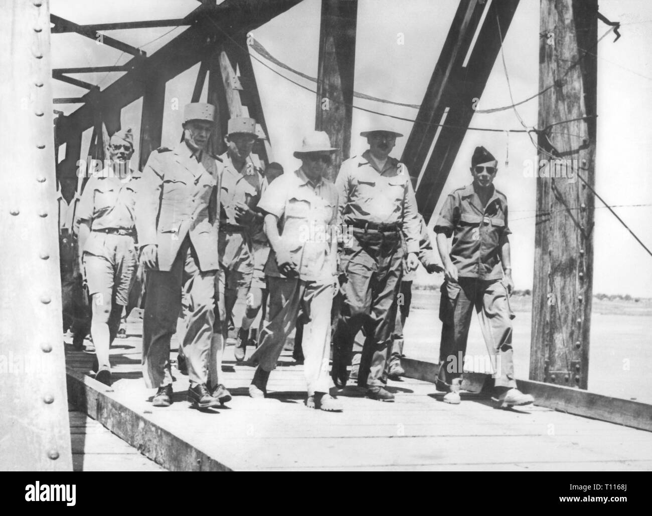 Indochina War 1946 - 1954, operation Atlante, January - March 1954, visit of president of the state Rene Pleven in the area of operations, 27.2.1954, with him permanent secretary in the War Office Pierre de Chevigne, general Henry Navarre, commander-in chief of the French armed forces in Indochina, and high commissioner general Paul Ely, front visit, bridges, railroad bridge, railway bridge, politician, politicians, military, officers, officer, wars, France, colonial war, French colony, 4th republic, politics, policy, Viet Nam, Vietnam, people, 2, Additional-Rights-Clearance-Info-Not-Available Stock Photo