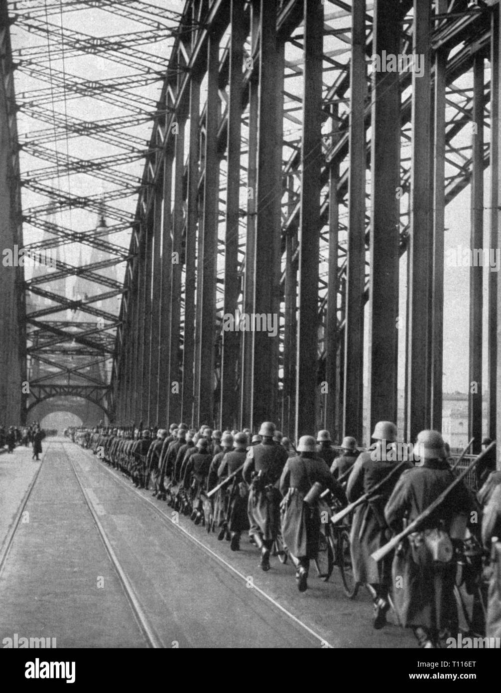 Nazism / National Socialism, politics, entry into demilitarized Rhineland, infantrymen are marching across the Deutzer Bridge, Cologne, 7.3.1936, Additional-Rights-Clearance-Info-Not-Available Stock Photo