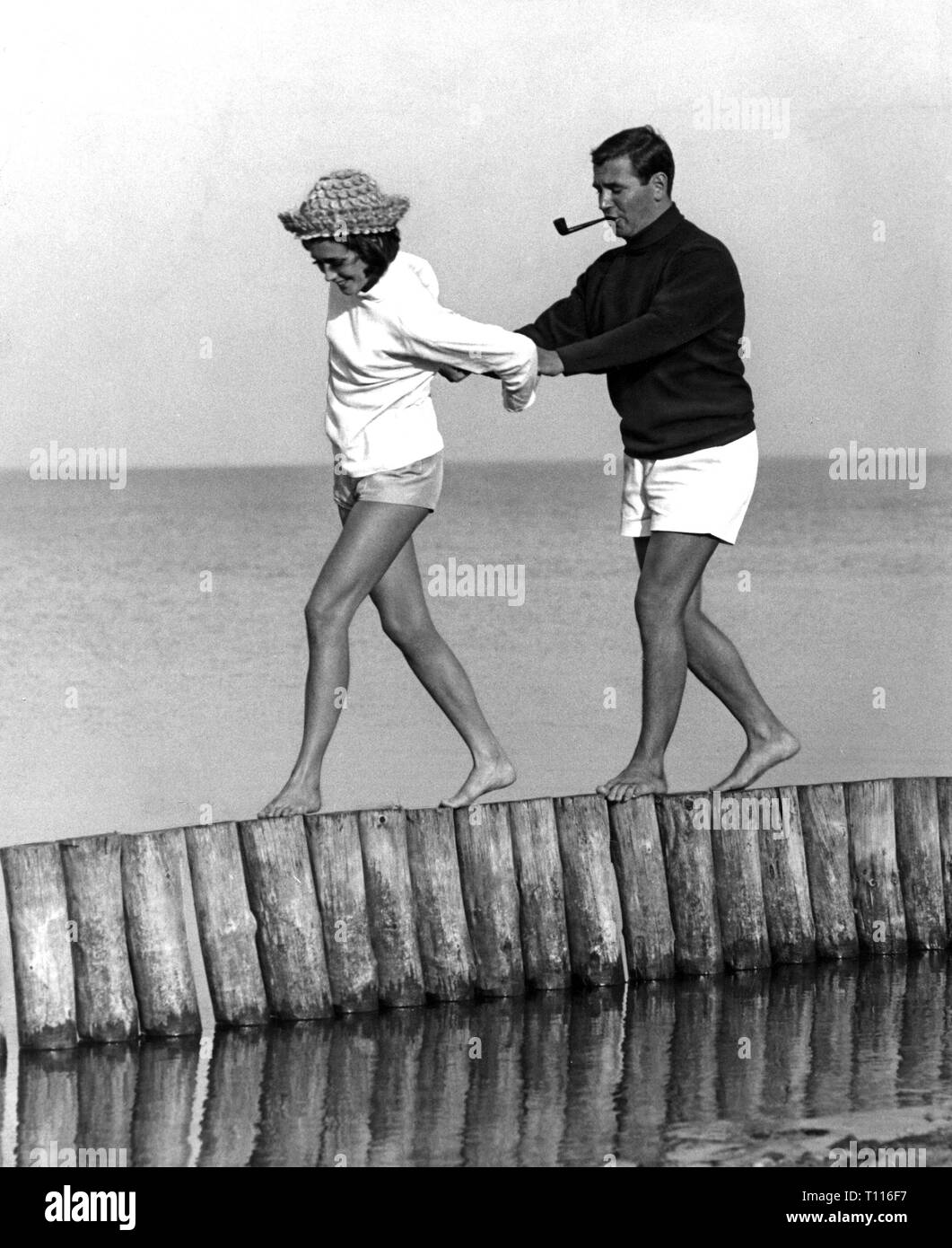 fashion, 1960s, beach fashion, couple in bathing wear on the beach, 1960s, Additional-Rights-Clearance-Info-Not-Available Stock Photo