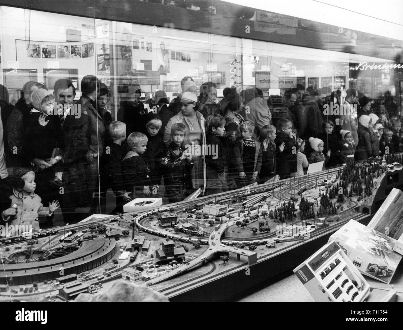 Christmas, shopping / presents, people in front of shop window with toy train, Hamburg, 17.10.1970, Additional-Rights-Clearance-Info-Not-Available Stock Photo
