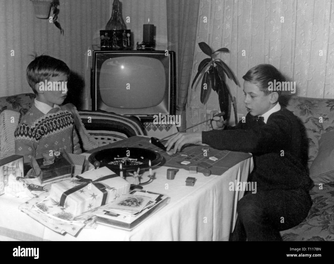 Christmas, distribution of presents, boys with roulette game, 1960s, Additional-Rights-Clearance-Info-Not-Available Stock Photo
