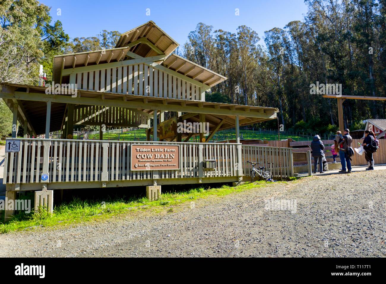 A family stands in front of the Cow Barn at Tilden Little Farm in Tilden Regional Park, an East Bay Regional Park in Berkeley, California, February 25, 2019. () Stock Photo