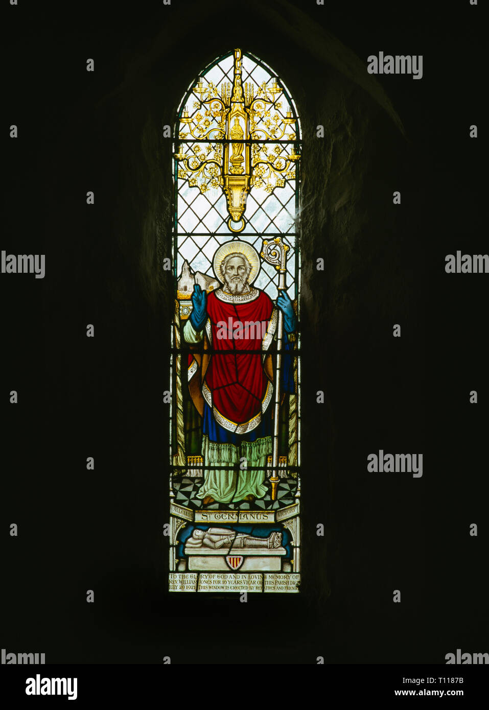 C20th memorial window to Rev. William Jones above vestry of St Garmon's Church, Llanarmon-yn-Iâl, Denbighshire, Wales, showing St Germanus of Auxerre. Stock Photo