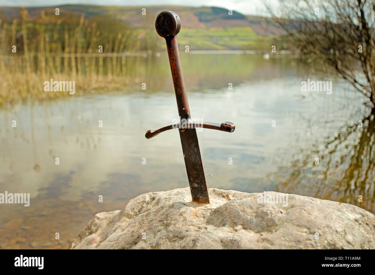 Great Britain, Wales, Llangorse Lake.  Stone celebrating King Arthur's Excalibur sword that was thrown into this Welsh lake. Stock Photo
