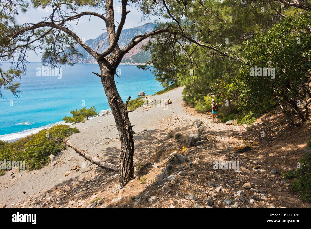 Downhill to sand dunes of Agios Pavlos beach from e4 trail between Loutro and Agia Roumeli at south-west of Crete island, Greece Stock Photo