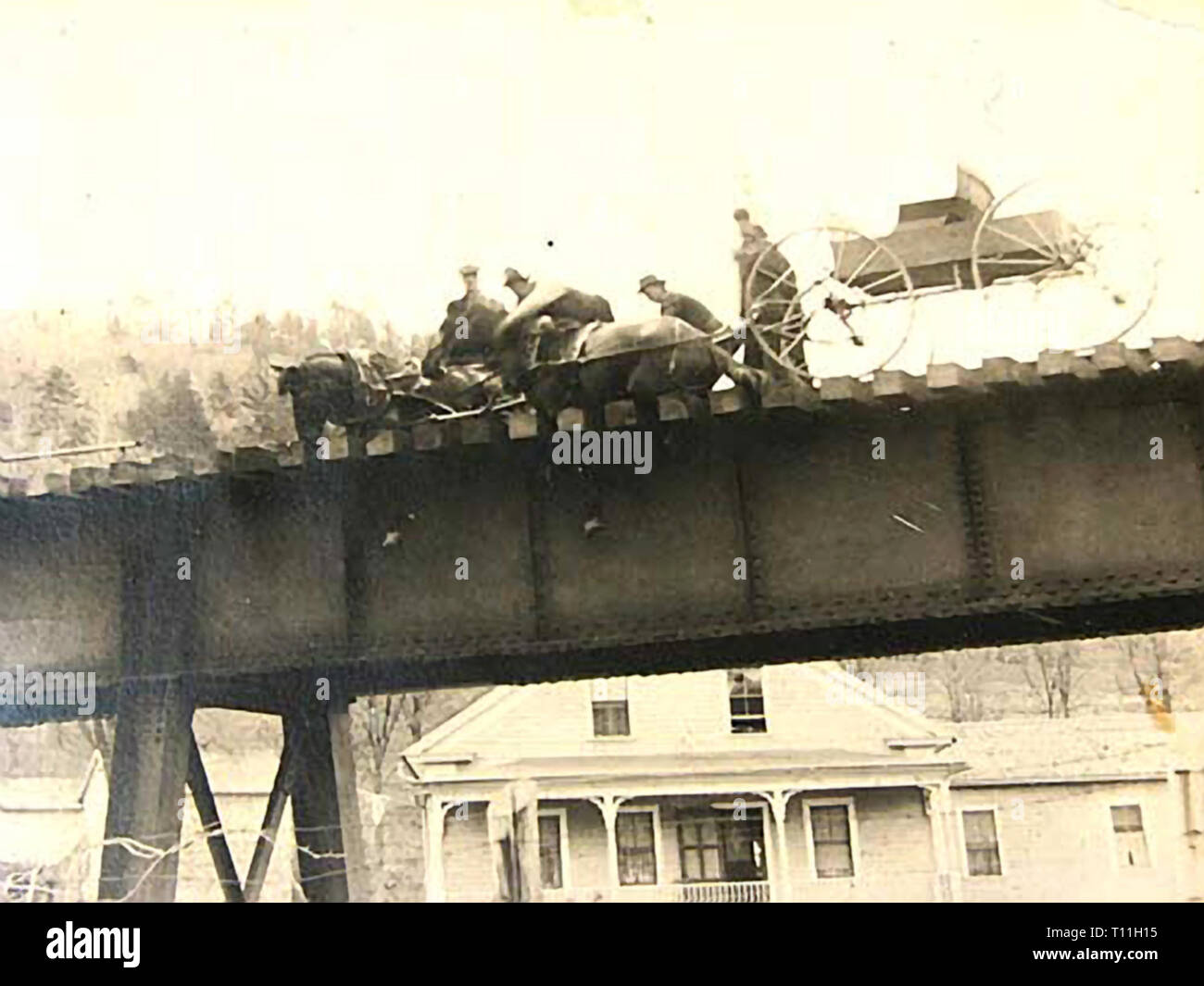 Photos of early America-Tragic event of horses getting stuck on a New England railroad bridge. Stock Photo