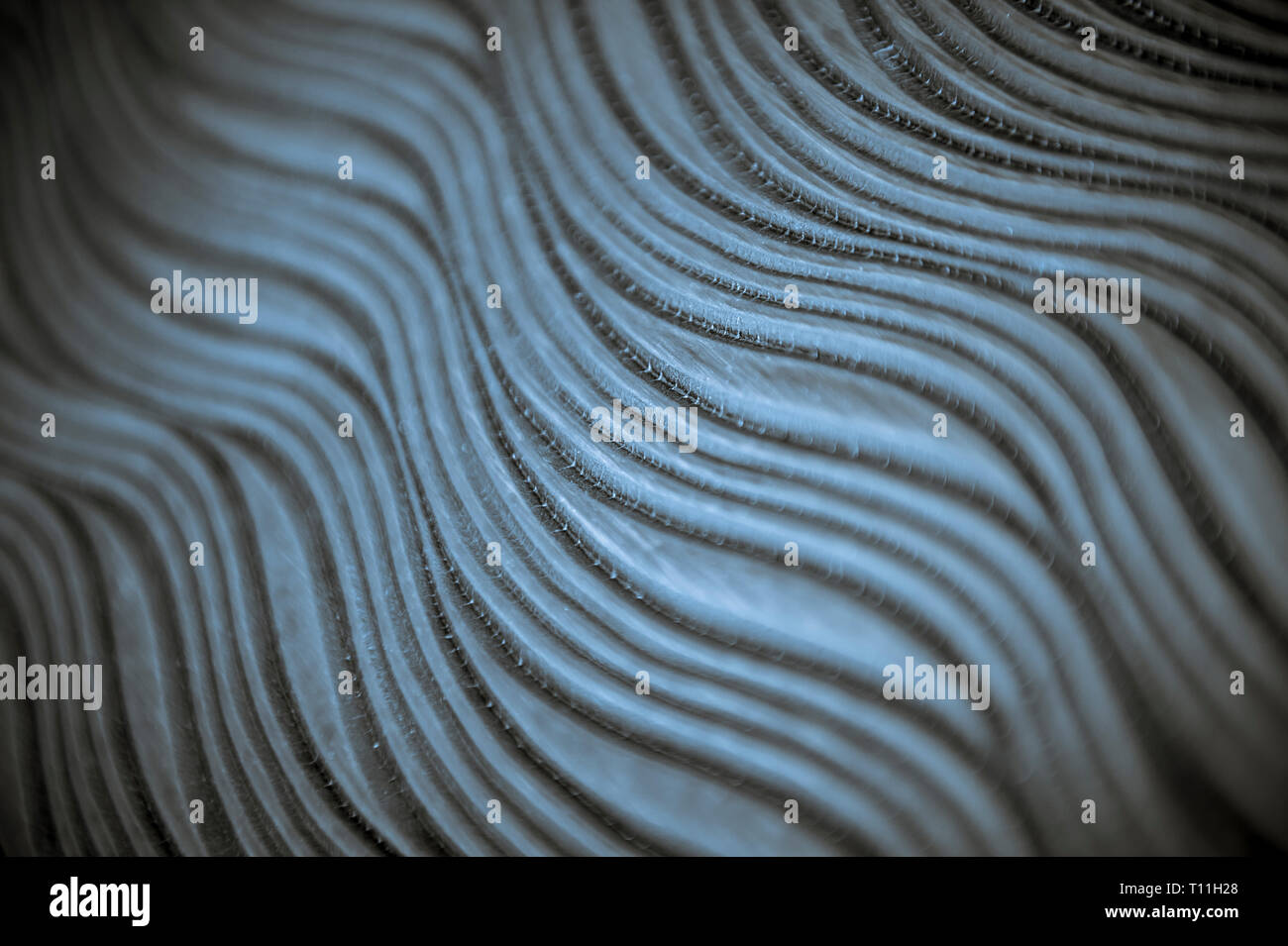 Textured Ridges Background Abstract wave pattern background with textured ridges in selective ...