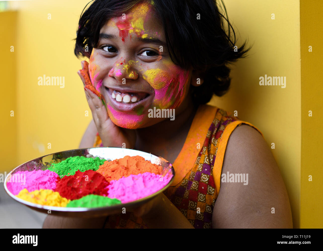 Little girl celebrating Holi, festival of colour Stock Photo