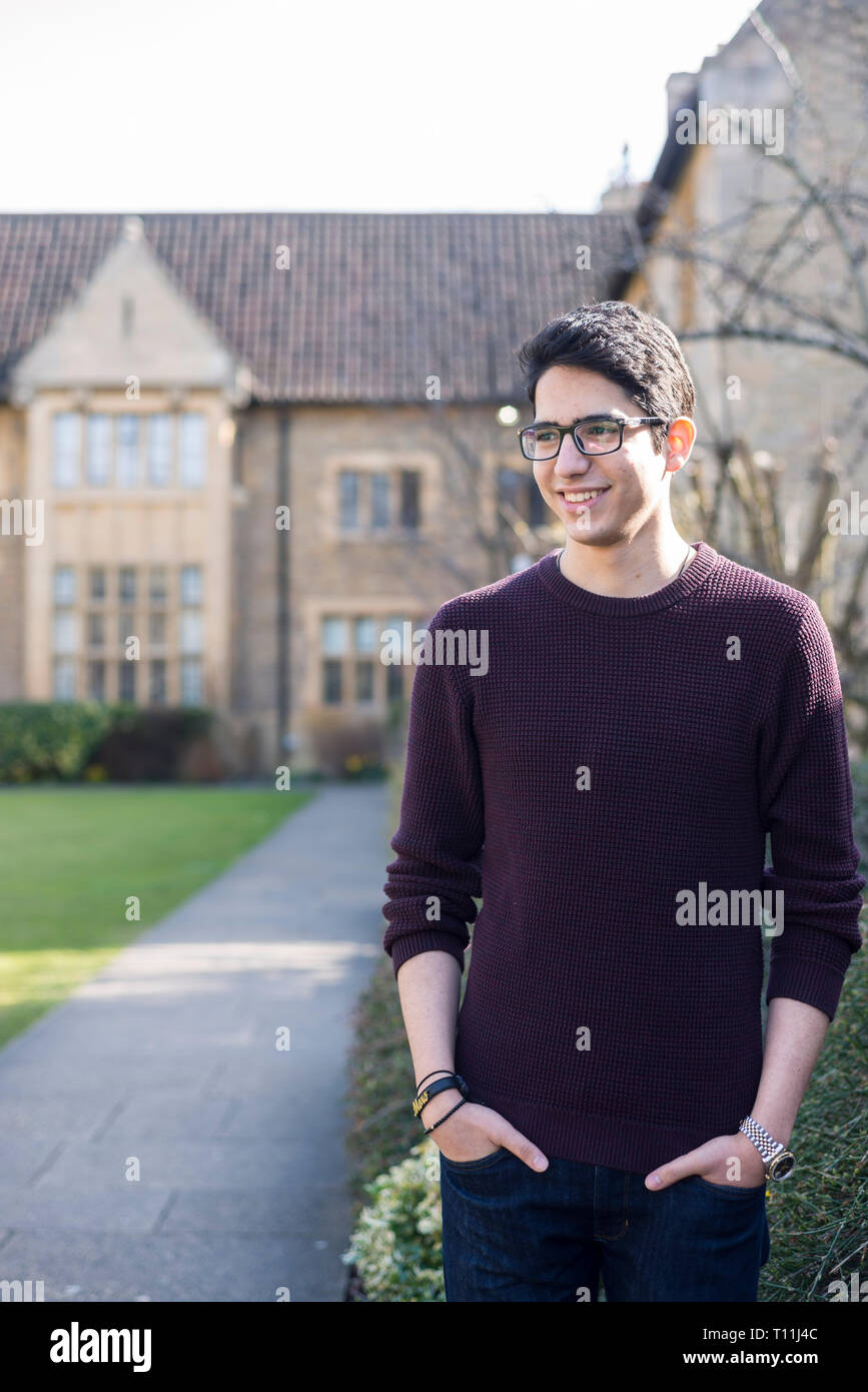 An arabic student from the Middle East outside in a traditional Oxbridge college Stock Photo