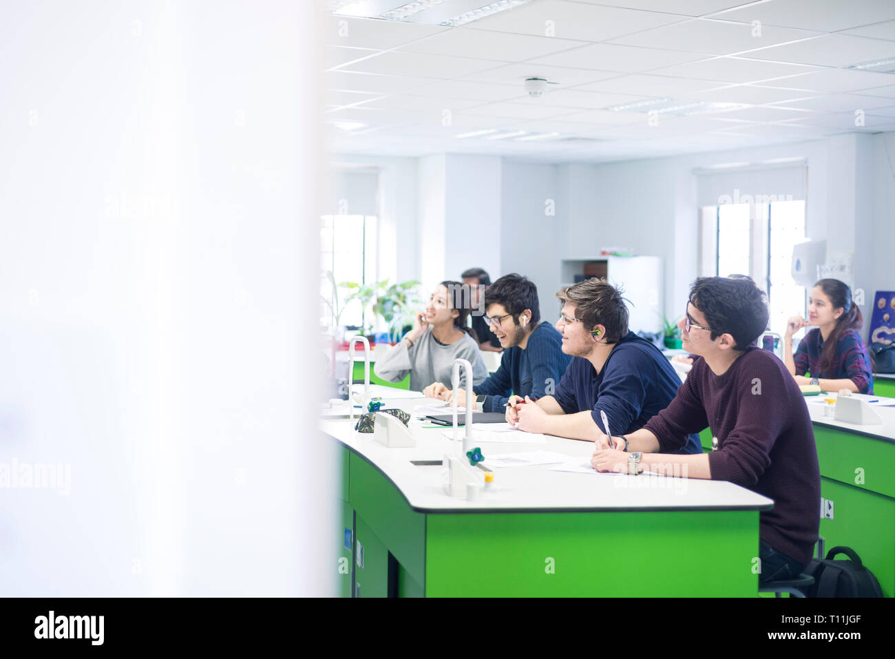 A classroom full of international students during a science lesson Stock Photo
