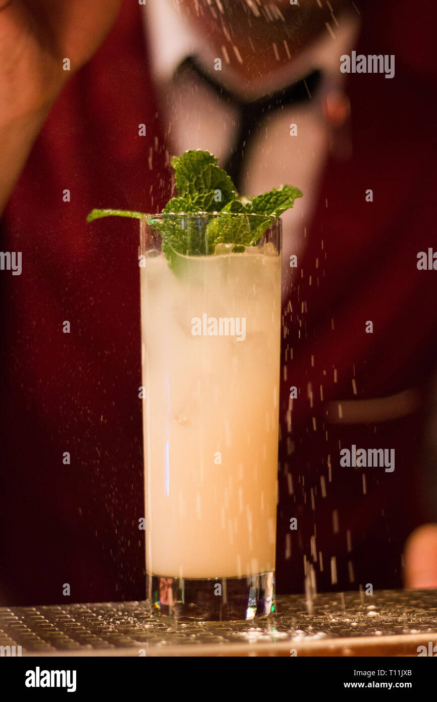 Cocktail with mint leafs and sugar powder Stock Photo