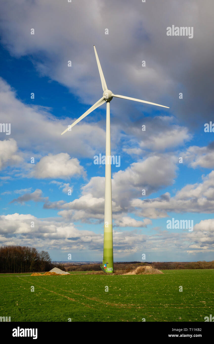 Ense, North Rhine-Westphalia, Germany - Windmills against a blue sky with clouds. Ense, Nordrhein-Westfalen, Deutschland - Windraeder vor blauem Himme Stock Photo