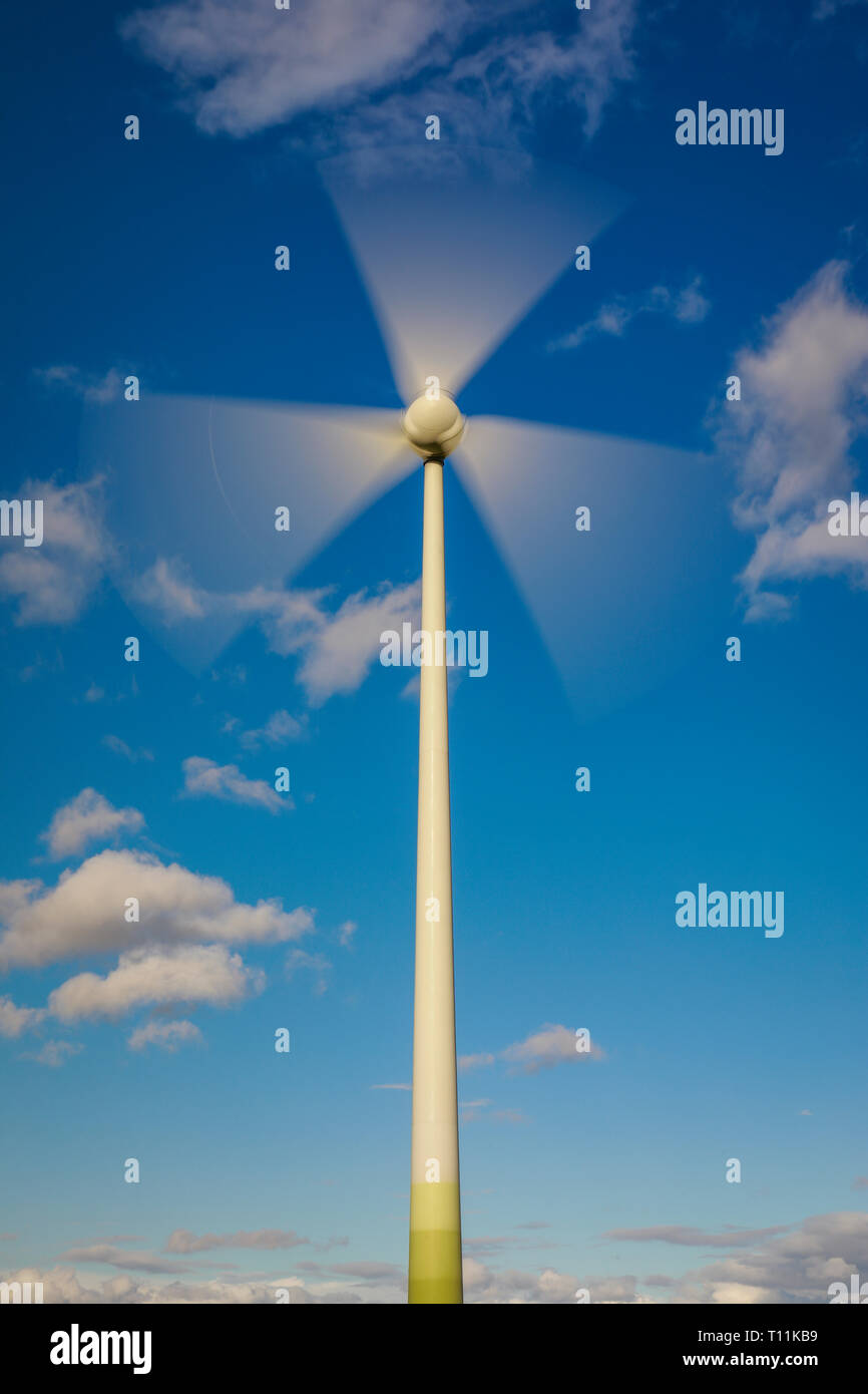 Ense, North Rhine-Westphalia, Germany - Wind turbine in front of a blue sky with clouds. Ense, Nordrhein-Westfalen, Deutschland - Windrad vor blauem H Stock Photo