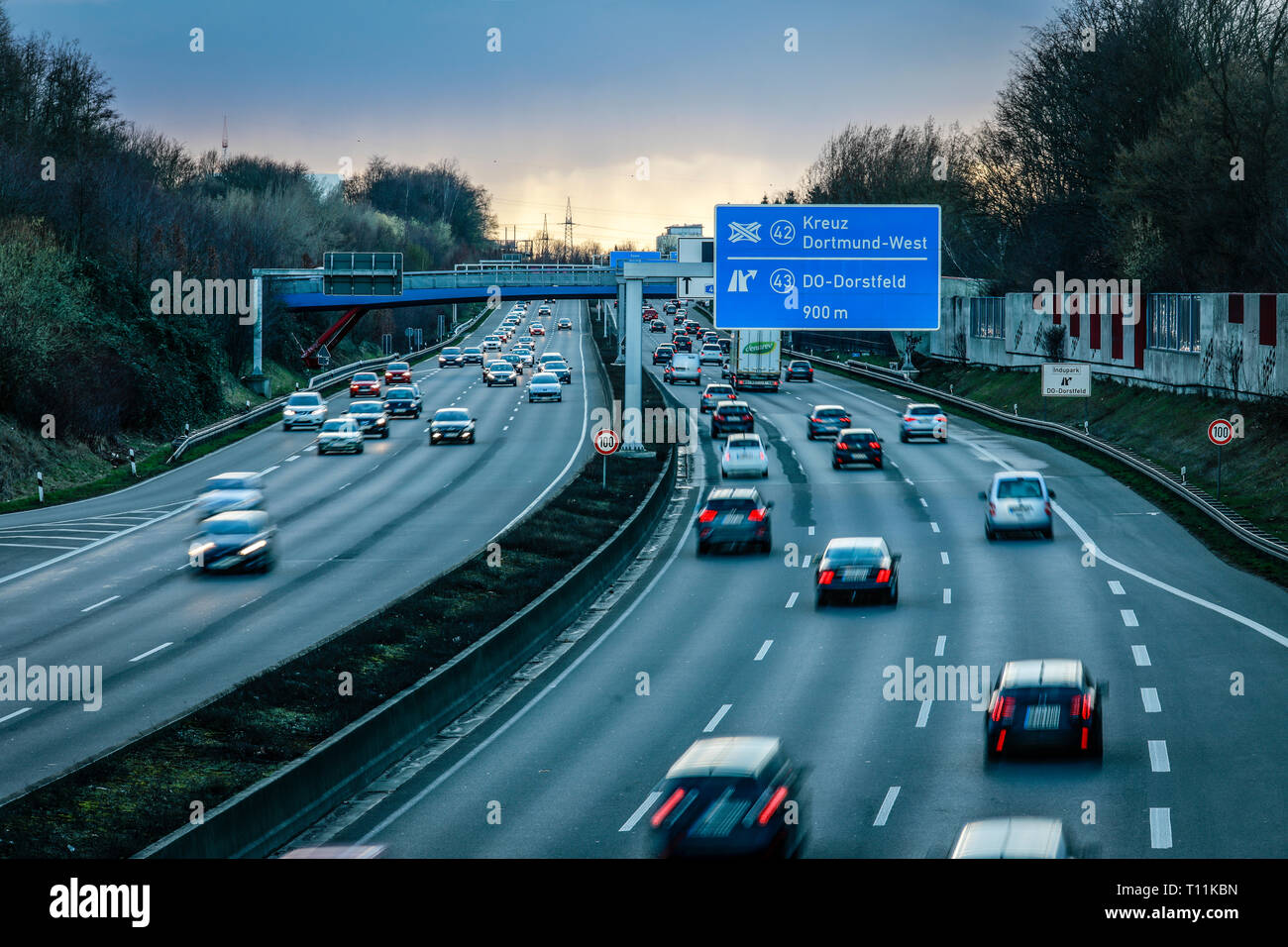 Dortmund, Ruhr area, North Rhine-Westphalia, Germany - Cars in the evening traffic on the Ruhr highway A40 in the evening at the intersection Dortmund Stock Photo