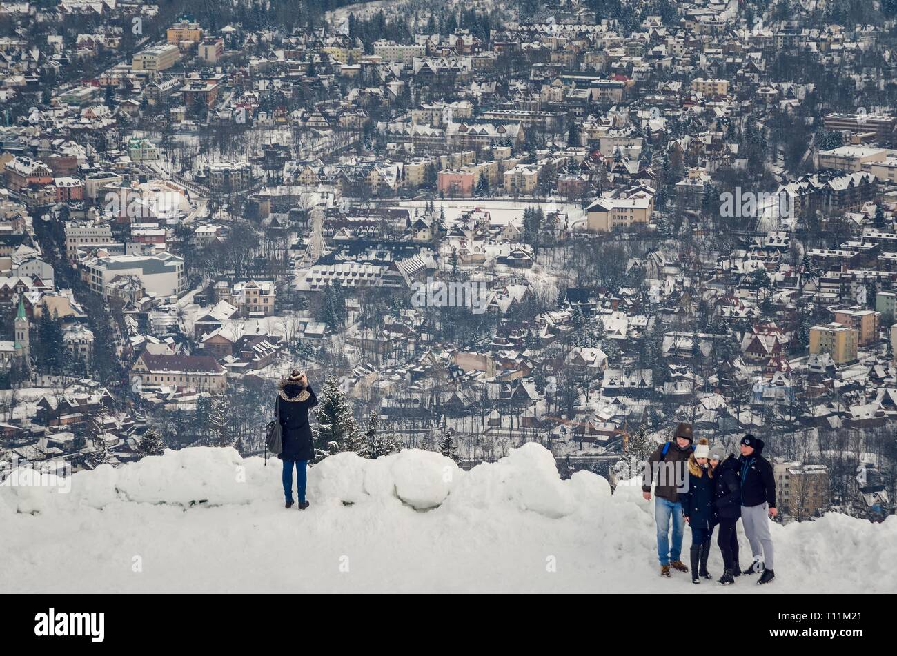 ZAKOPANE, POLAND - DECEMBER 30, 2018: Tourists at the top of the popular Gubalowka peak in Zakopane, Poland. Stock Photo