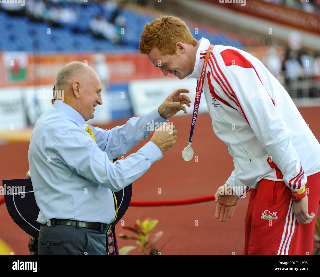 Greg Rutherford Podium DELHI, INDIA - OCTOBER 10: Greg Rutherford (Silver) receiving his medal ...