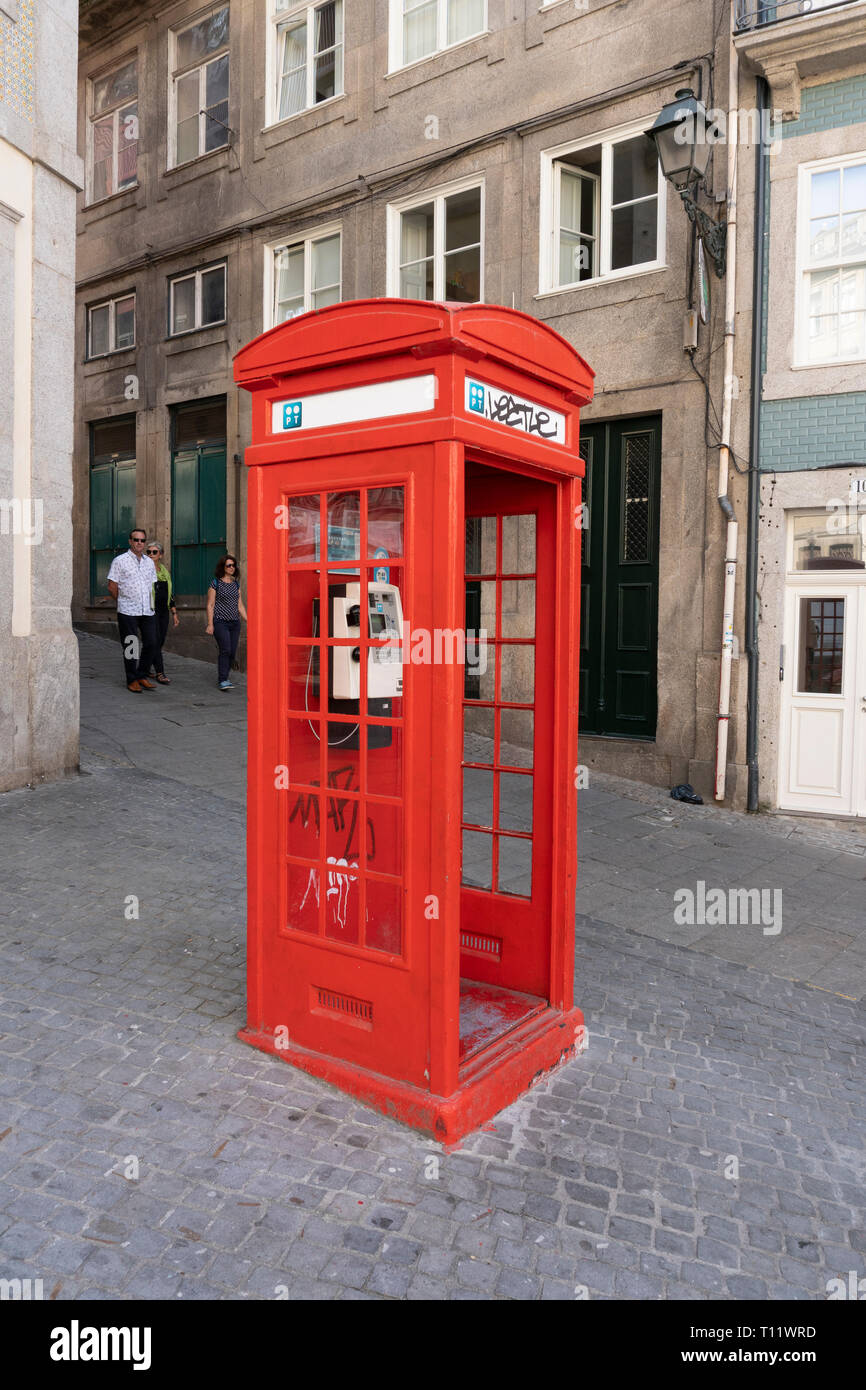 Porto, Portugal; september 28 2018: Old red telephone cabin on street. Public phone, Portugal telecom Stock Photo