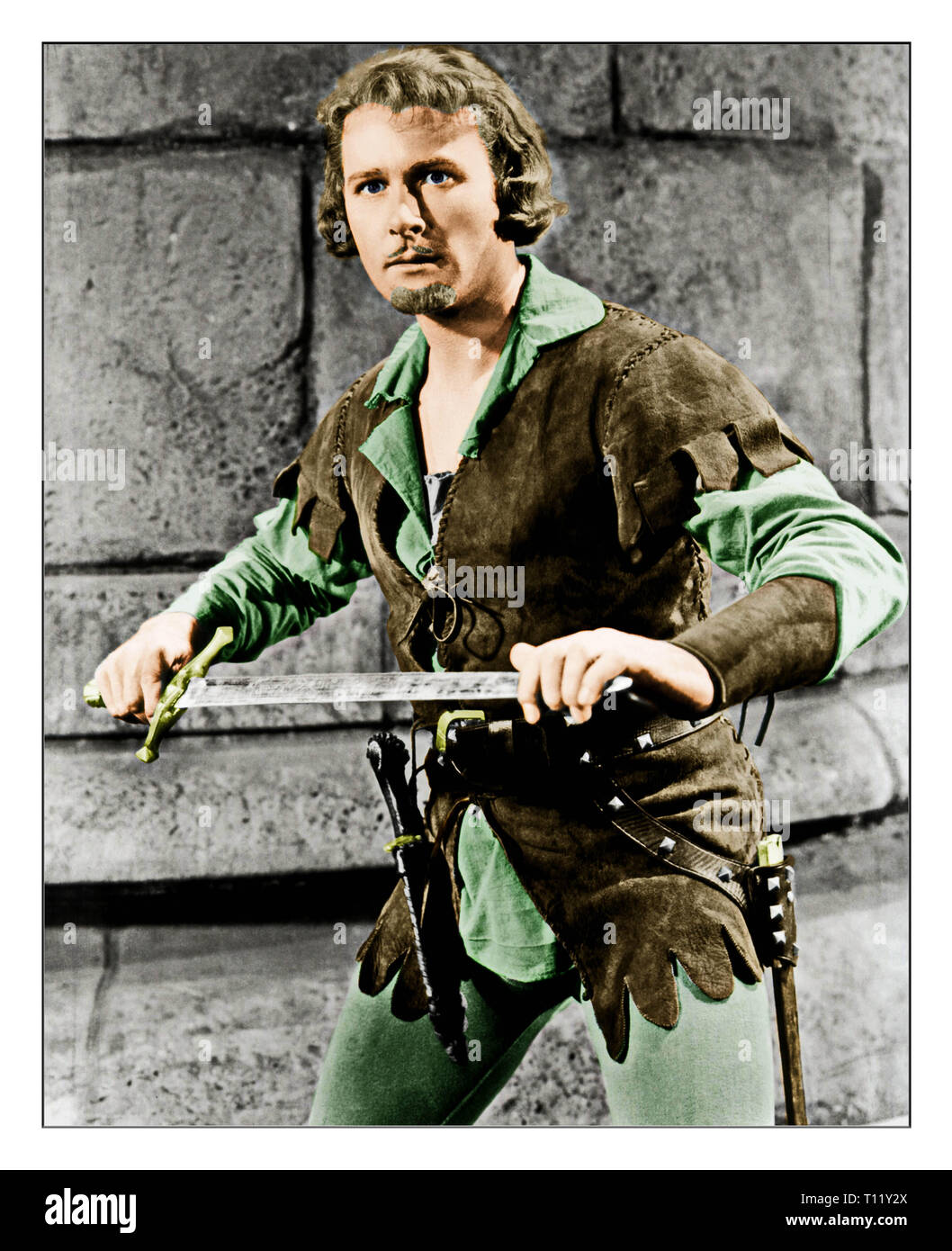 The Adventures of Robin Hood is a 1938 American Technicolor swashbuckler film from Warner Bros., produced by Hal B. Wallis and Henry Blanke, directed by Michael Curtiz and William Keighley, that stars Errol Flynn, Olivia de Havilland, Basil Rathbone, and Claude Rains. Credit: Hollywood Photo Archive / MediaPunch Stock Photo