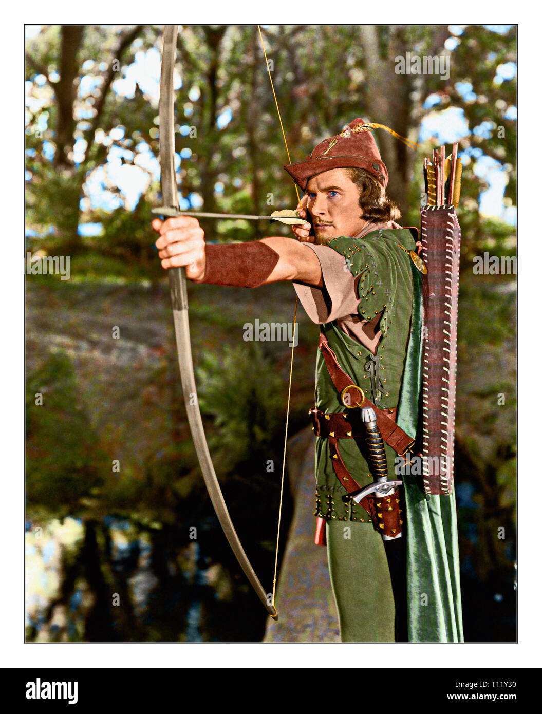 The Adventures of Robin Hood is a 1938 American Technicolor swashbuckler film from Warner Bros., produced by Hal B. Wallis and Henry Blanke, directed by Michael Curtiz and William Keighley, that stars Errol Flynn, Olivia de Havilland, Basil Rathbone, and Claude Rains. Credit: Hollywood Photo Archive / MediaPunch Stock Photo