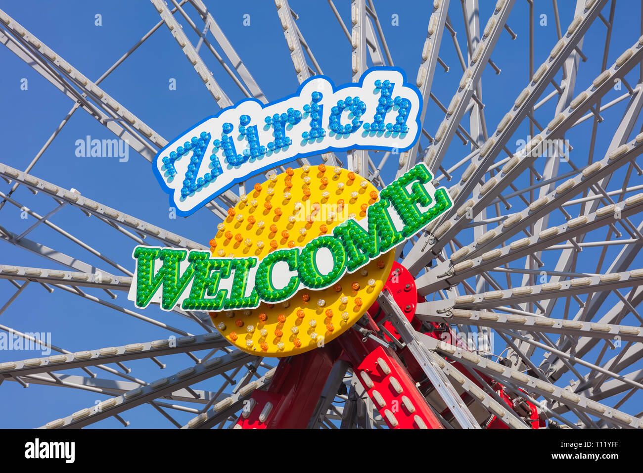 Zurich, Switzerland - March 22, 2019: the central part of a ferris wheel bearing a 'Zurich Welcome' sign. Zurich is the largest city in Switzerland an Stock Photo