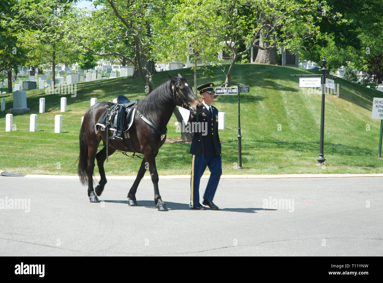 Arlington Virginia, USA, 20th April, 2012 Arlington National Cemetery, in Arlington County, Virginia, directly across the Potomac River from the Lincoln Memorial, is a United States military cemetery beneath whose 624 acres have been laid casualties, and deceased veterans, of the nation's conflicts beginning with the American Civil War, as well as reinterred dead from earlier wars. It was established during the Civil War on the grounds of Arlington House, which had been the estate of the family of Confederate general Robert E. Lee's wife Mary Anna (Custis) Lee (a great-granddaughter of Martha  Stock Photo