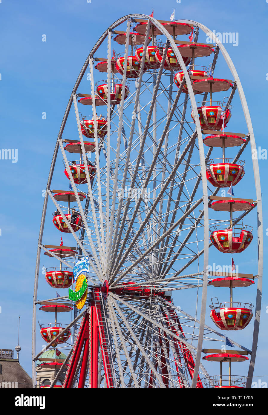 Zurich, Switzerland - March 22, 2019: a ferris wheel bearing a 'Zurich Welcome' sign. Zurich is the largest city in Switzerland and the capital of the Stock Photo