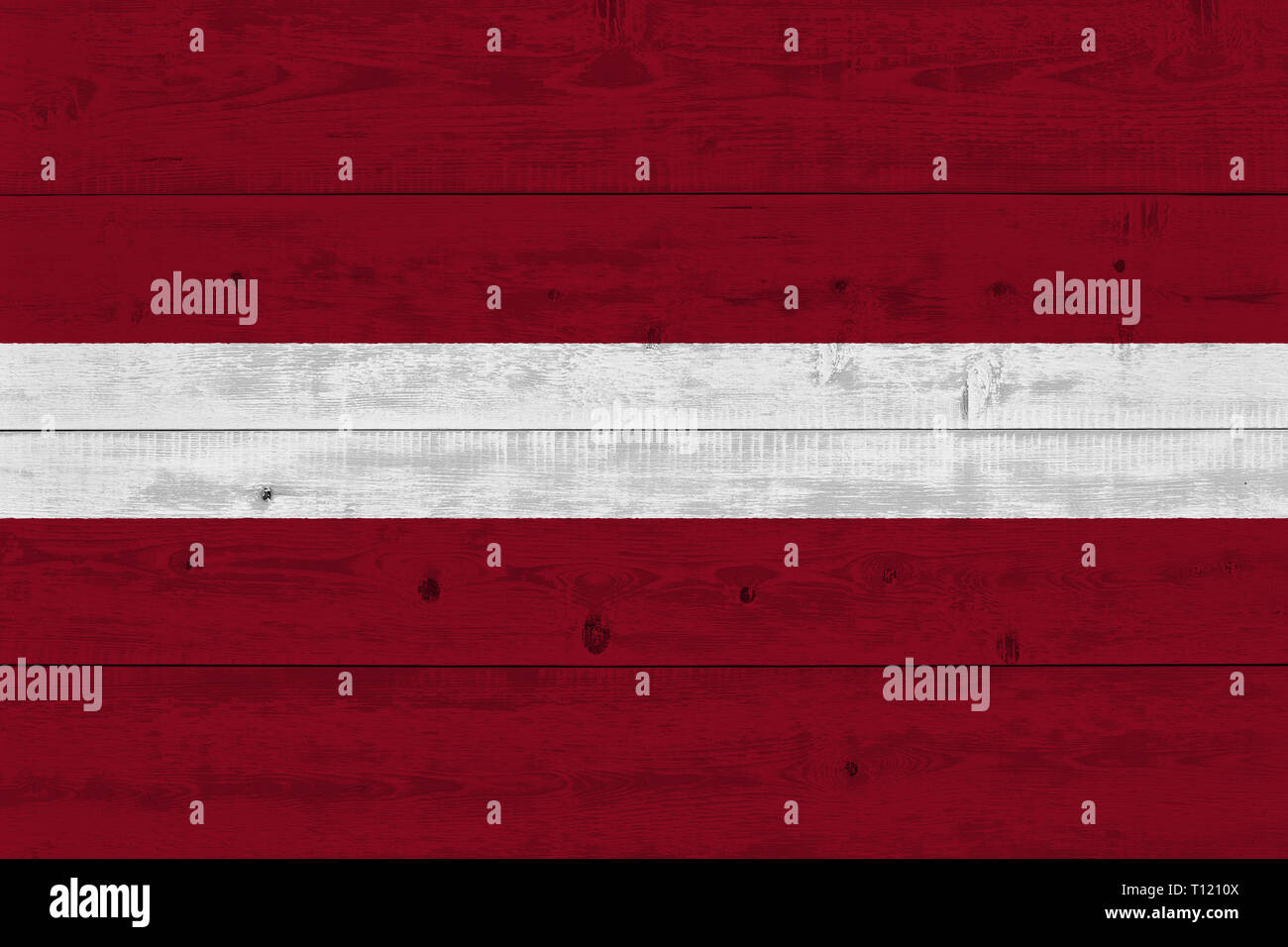 latvia flag painted on old wood plank. Patriotic background. National ...