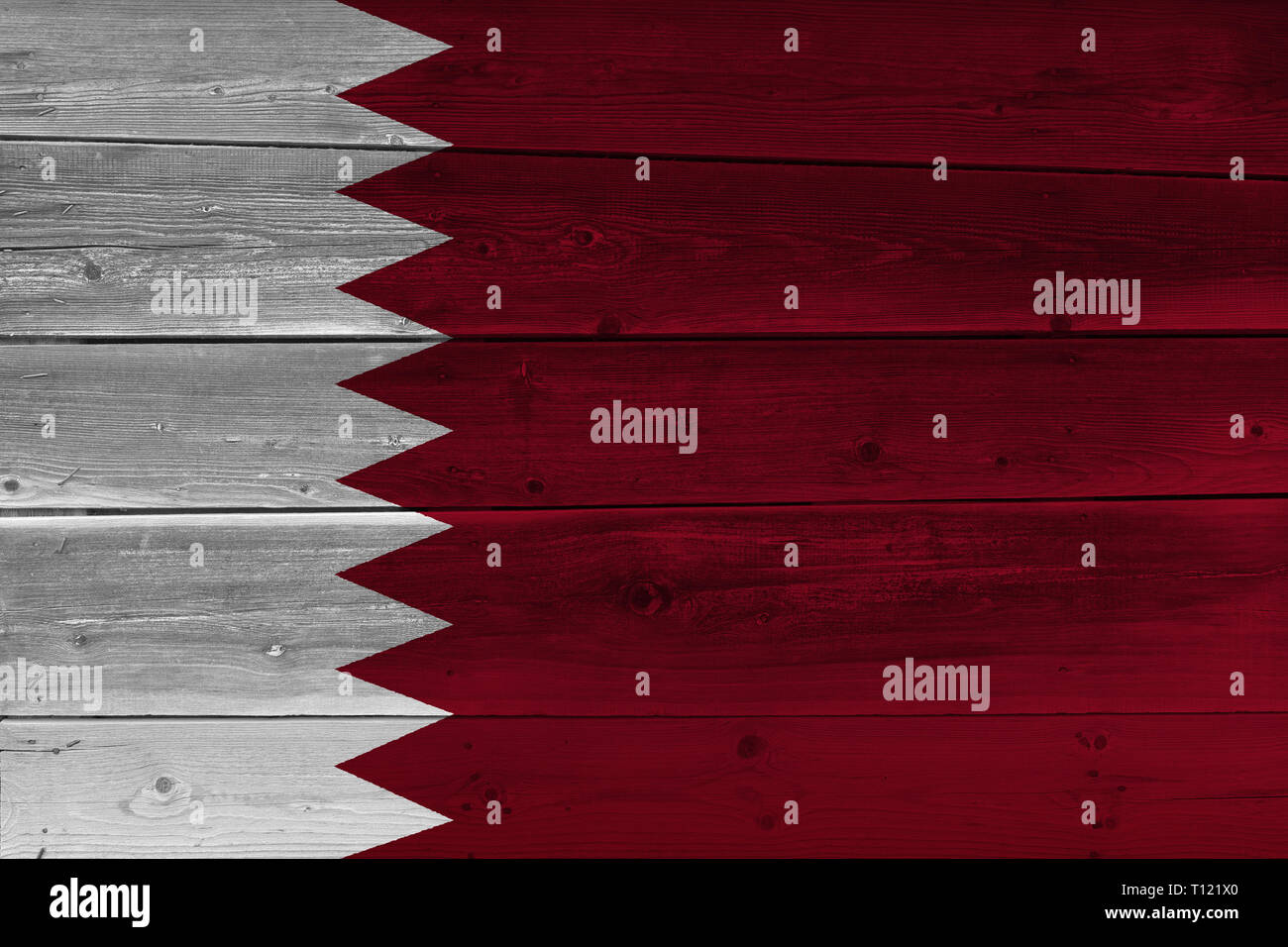 Qatar flag painted on old wood plank. Patriotic background. National