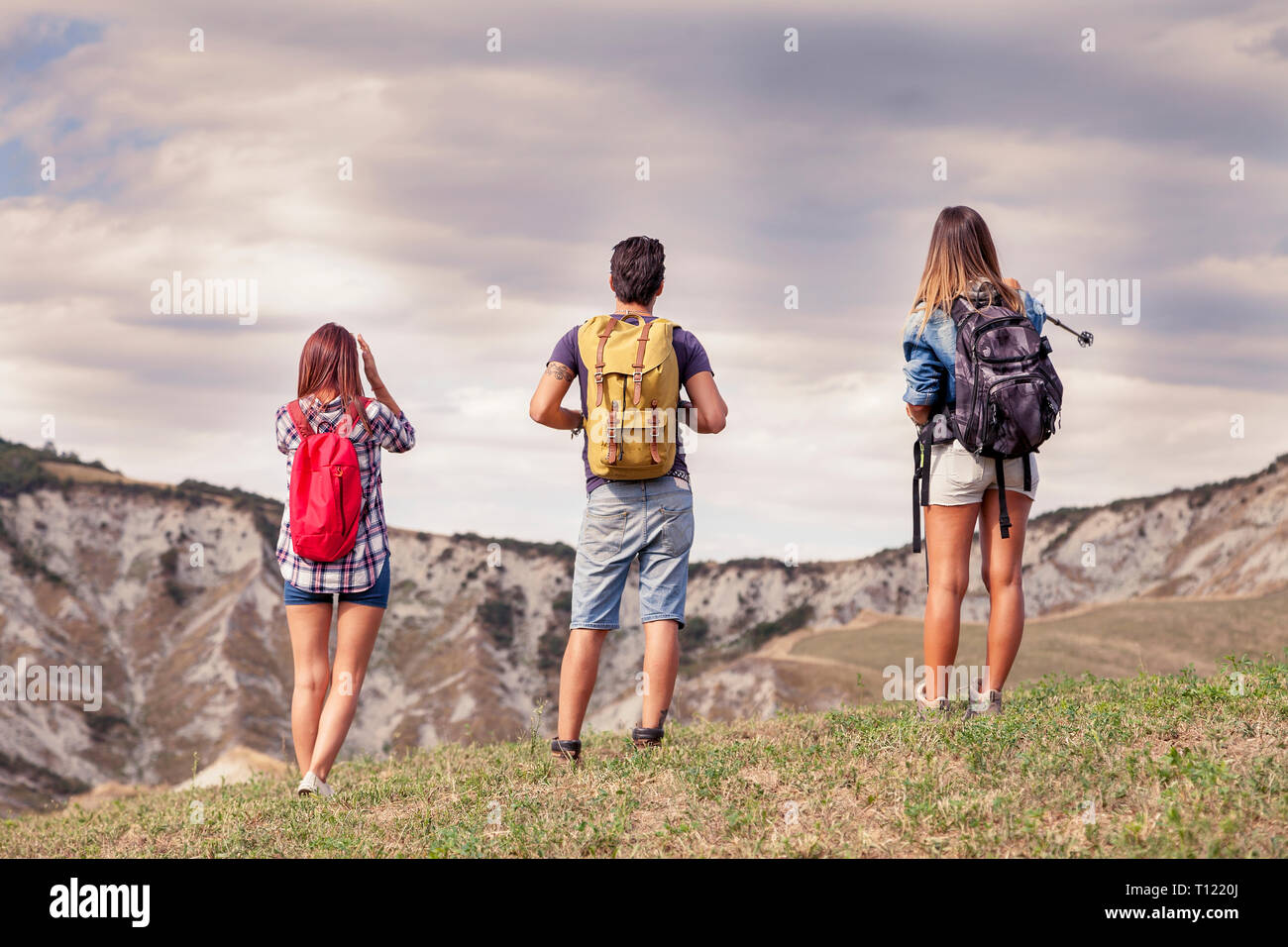 group of young hikers in the mountain looking at the horizon Stock ...