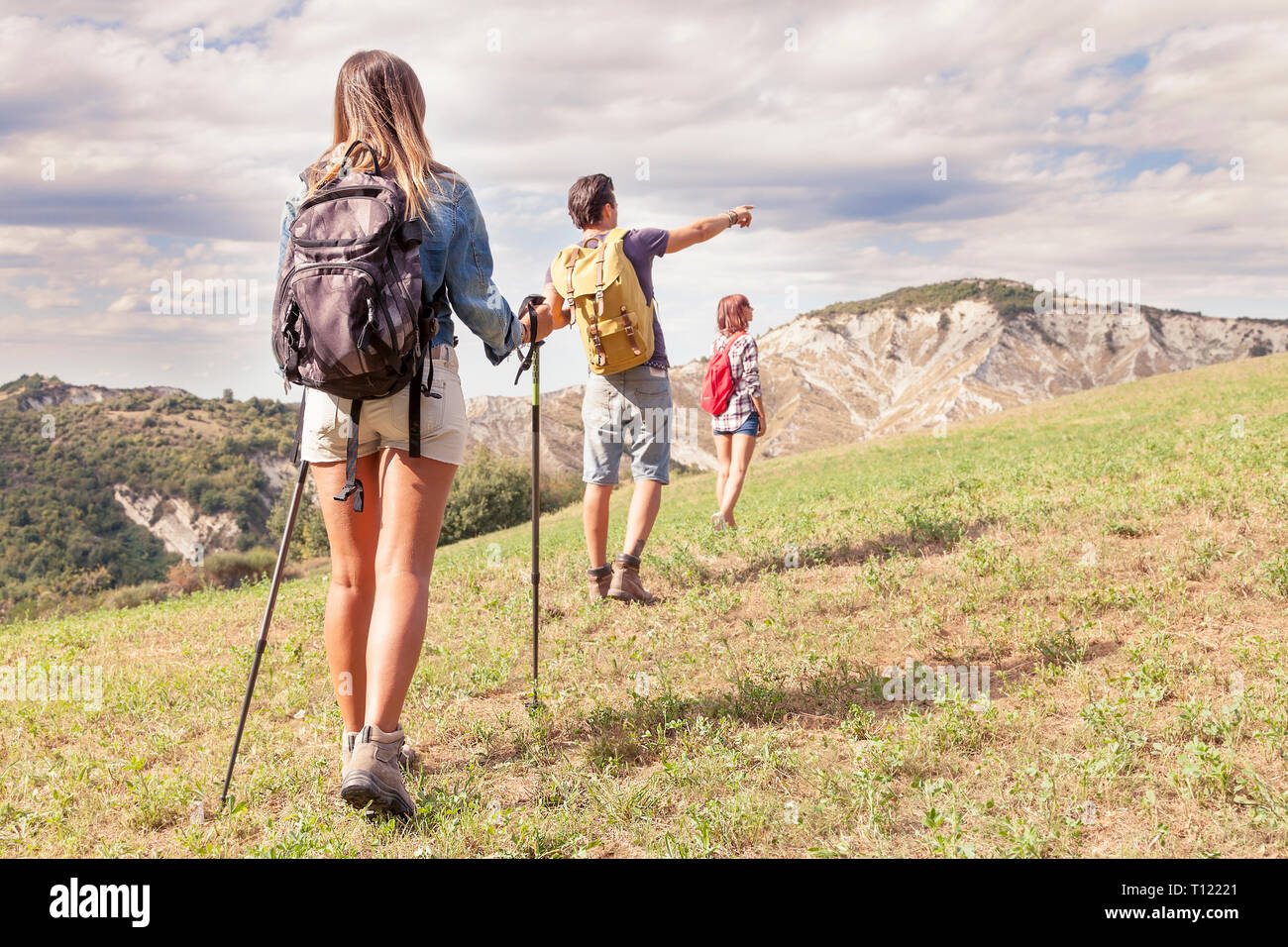 group of young hikers in the mountain in single file Stock Photo - Alamy
