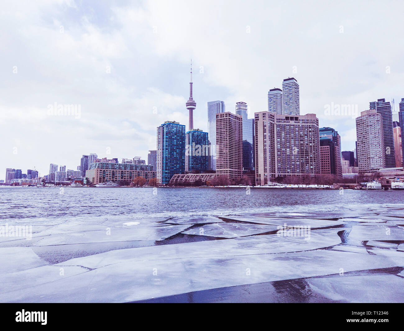 View of Toronto city skyline form a boat as it crosses the frozen Lake Ontario Stock Photo