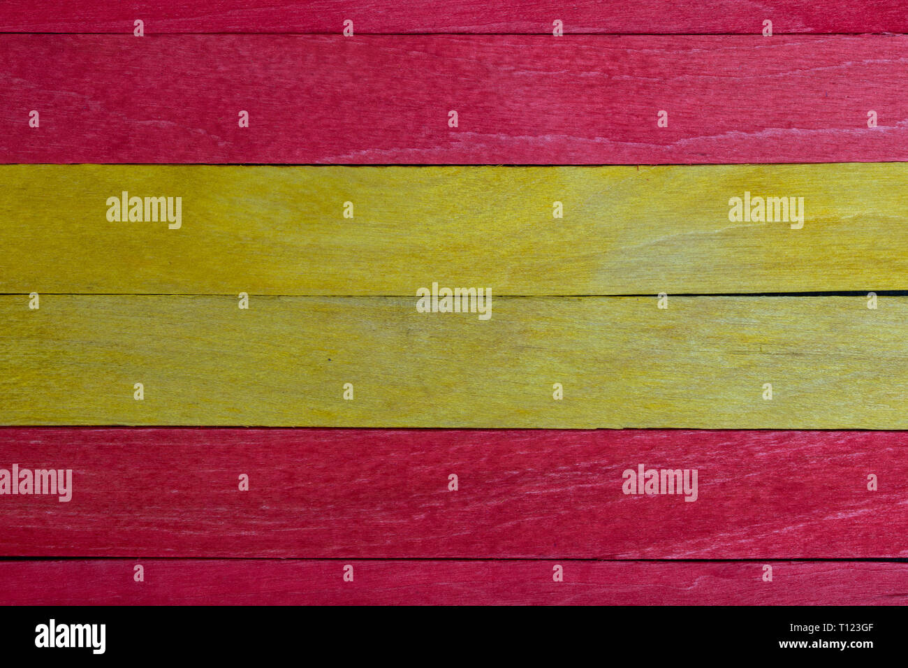 Beautiful texture of natural wood slats of red and yellow colors