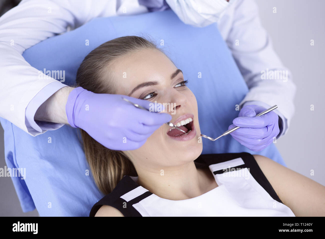 beautiful girl in the dental chair on the examination at the de Stock Photo
