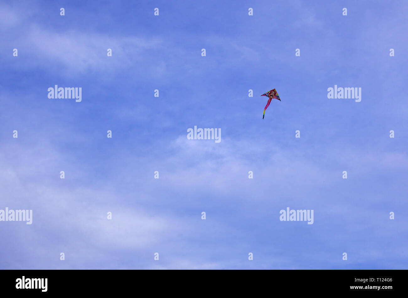 Kite flying, deep blue sky with some clouds. Clean Monday holiday