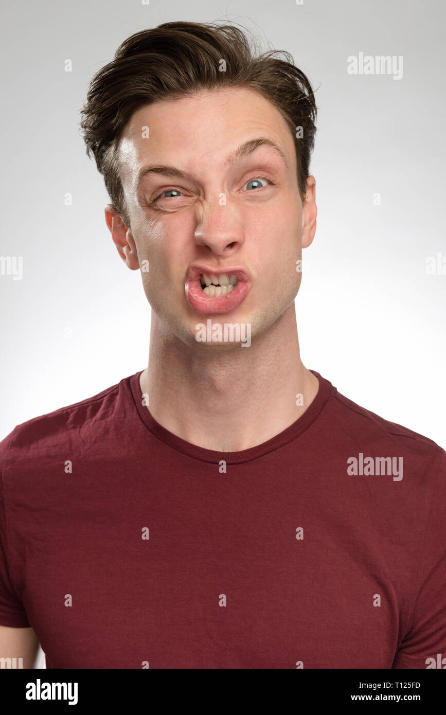 portrait series of a young white man with different facial expressions