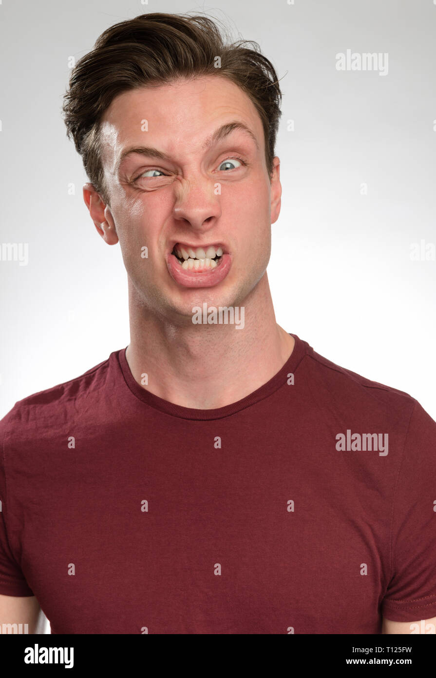 portrait series of a young white man with different facial expressions