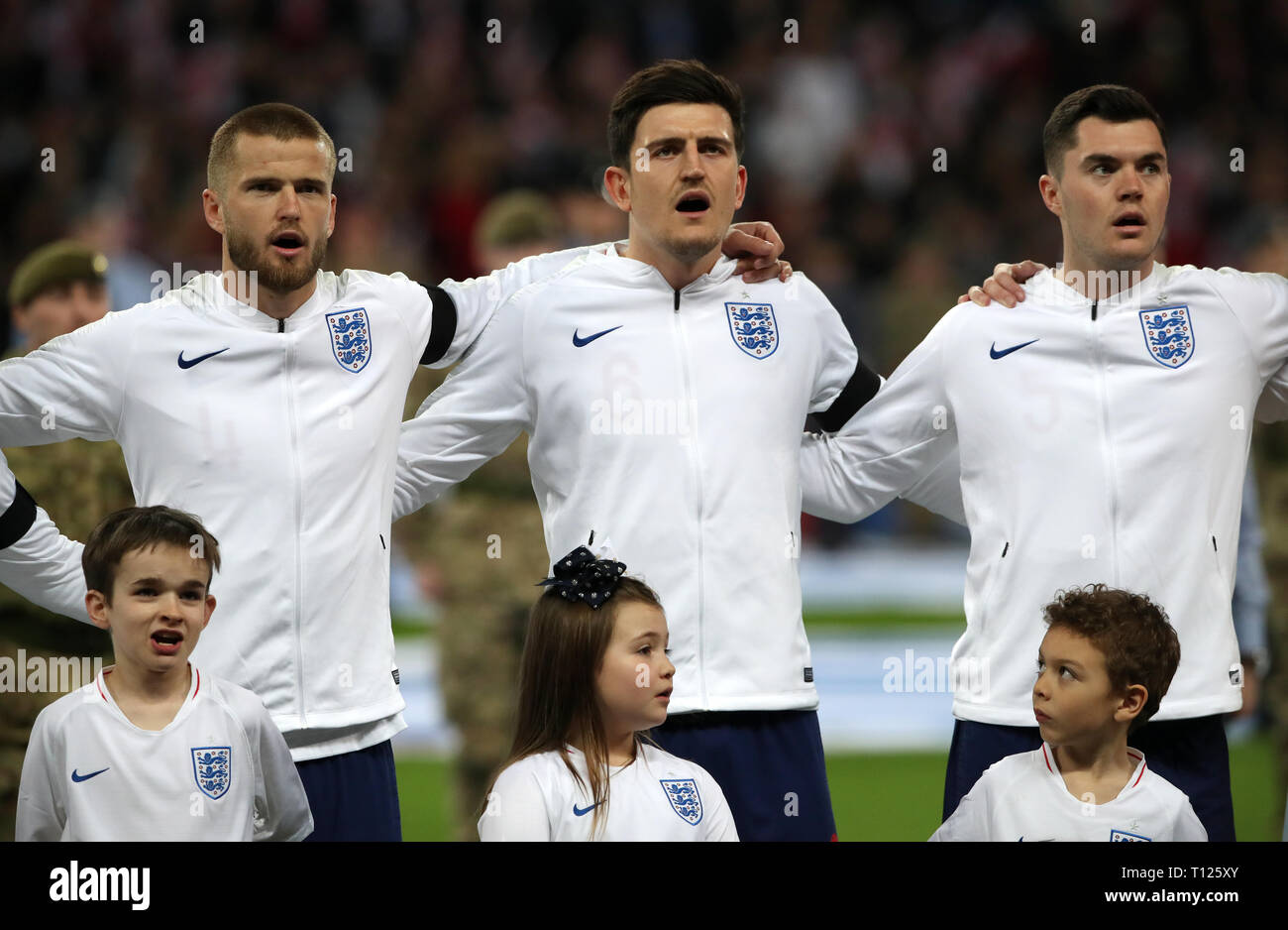England's Eric Dier (left), Harry Maguire (centre) and Michael Keane line up prior to the UEFA Euro 2020 Qualifying, Group A match at Wembley Stadium, London. Stock Photo