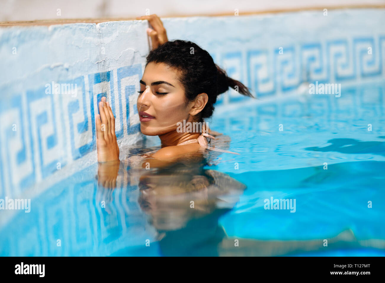 African woman swimming pool hi-res stock photography and images - Alamy