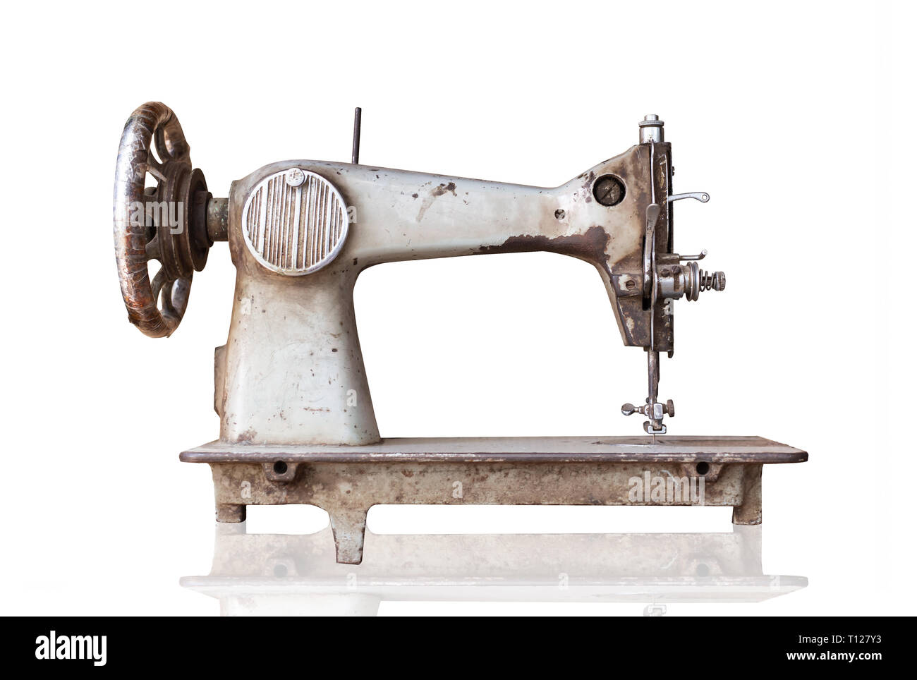 old sewing machine isolated on white background with clipping path. Stock Photo