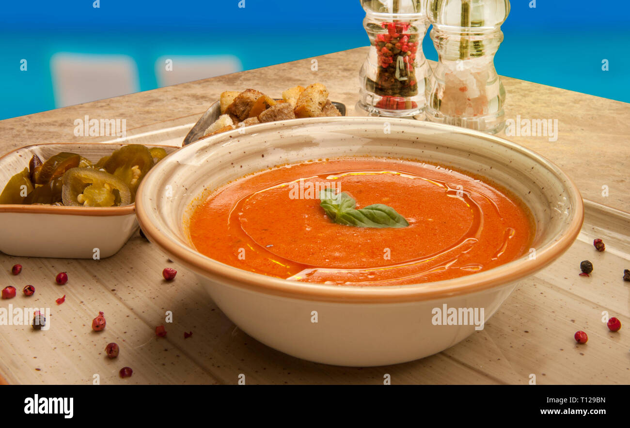 Anatolian style tomato soup prepared with pickles and spices. Anadolu Usulü hazırlanmış, turşu ve baharatlar ile servis edilmiş domates çorbası. Stock Photo