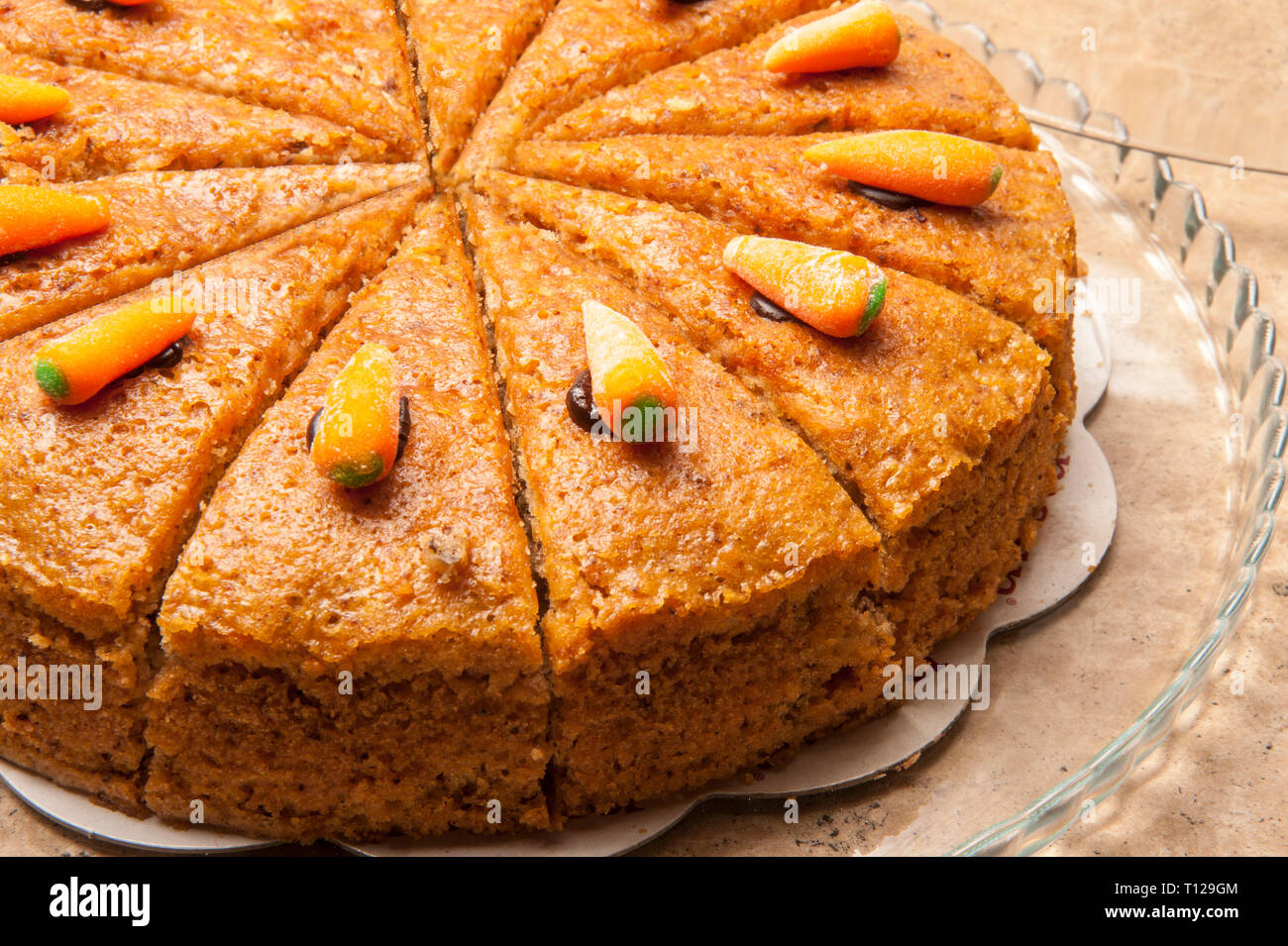 Carrot cake ready to be served. Triangle-sliced carrot cake is the favorite dessert of people especially those who are fond of taste. Stock Photo