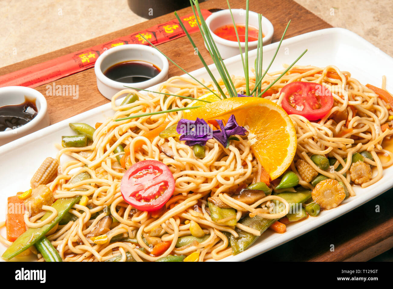 On the beach, a restaurant at the seaside and a chinese noodle at a restaurant. A nice menu to choose from for a delicious dinner. Stock Photo