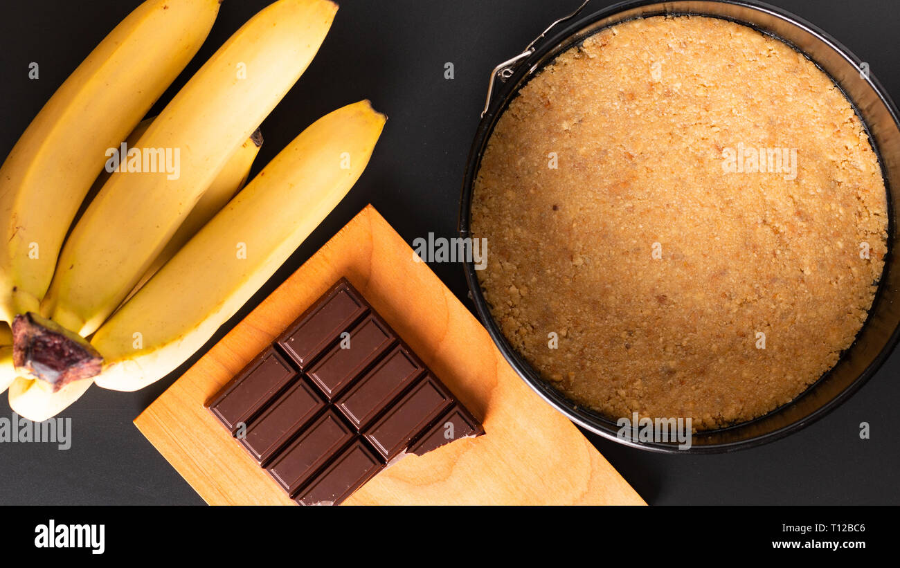 Food concept making dessert  homemade banoffee pie on black background Stock Photo