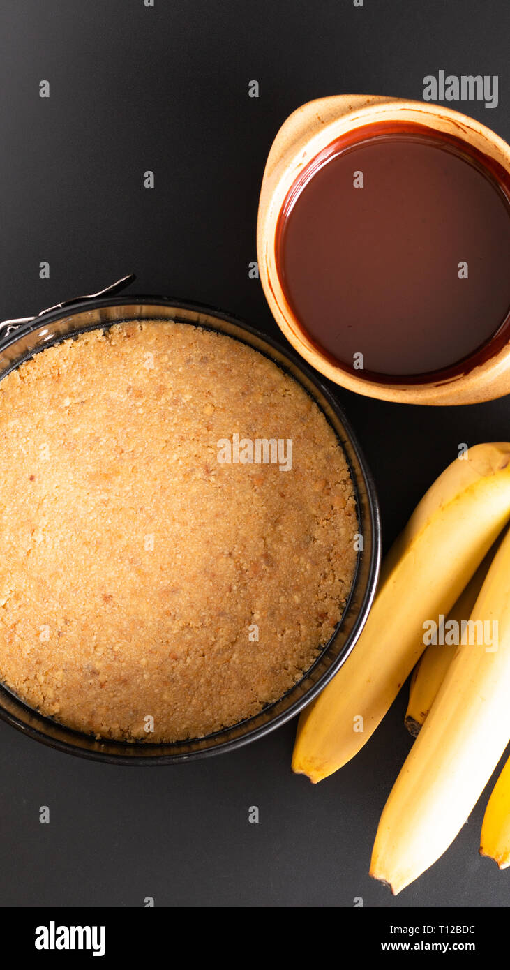 Food concept making dessert  homemade banoffee pie on black background Stock Photo