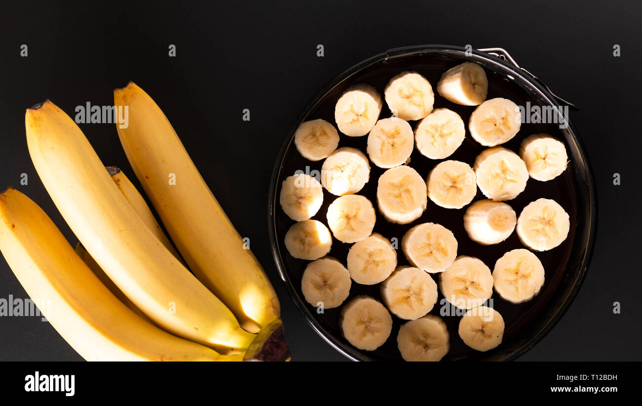 Food concept making dessert  homemade banoffee pie on black background Stock Photo