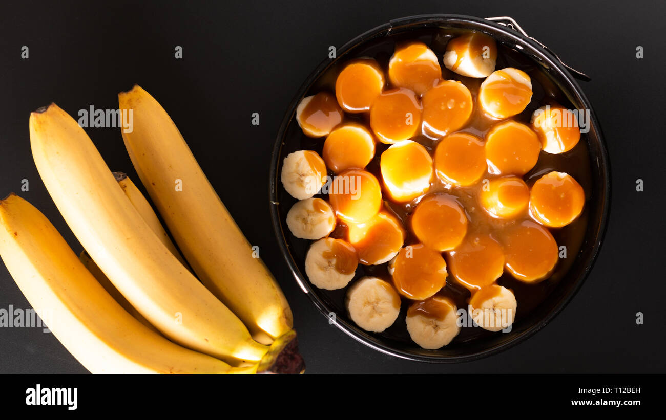 Food concept making dessert  homemade banoffee pie on black background Stock Photo