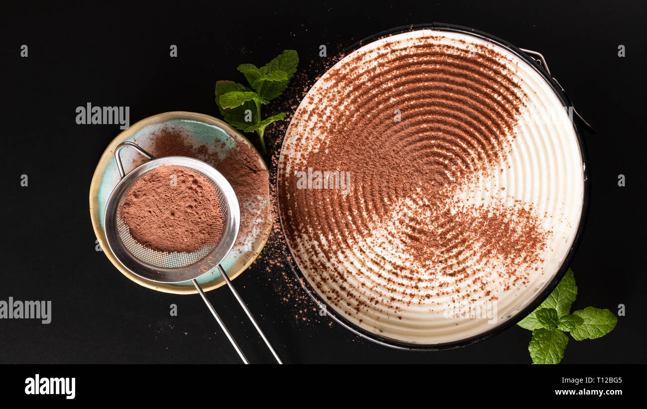 Food concept making dessert  homemade banoffee pie on black background Stock Photo